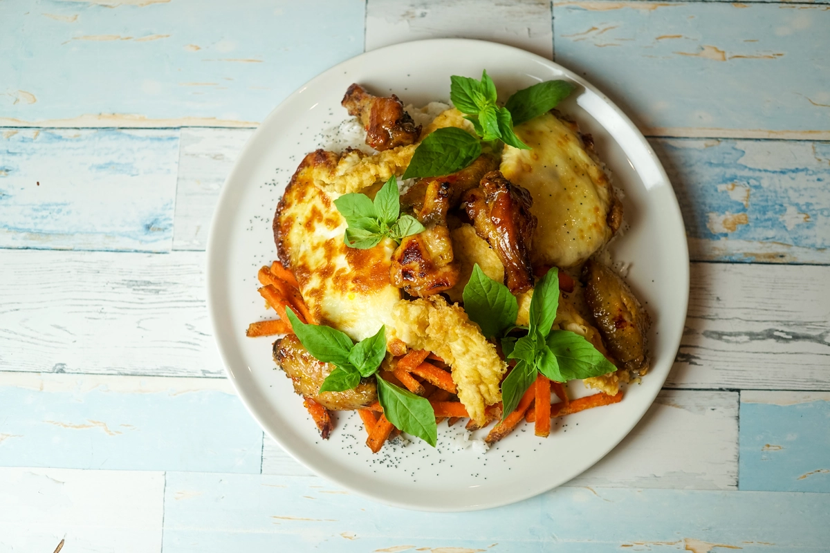 Grilled Alice Springs Chicken topped with bacon, melted cheese, and honey mustard sauce.
