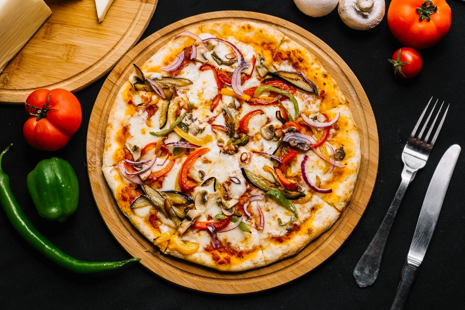 A close-up of a supreme pizza slice, featuring vibrant toppings like pepperoni, sausage, green bell peppers, onions, and black olives on a golden, crispy crust.